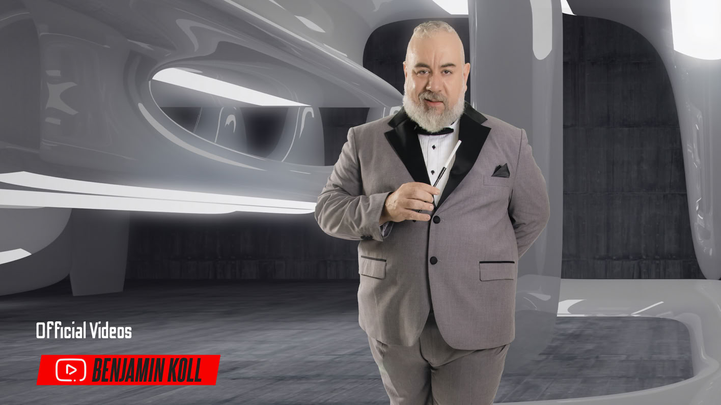 A man in a gray suit with a black bow tie stands in a futuristic, sleek interior with curved architecture.